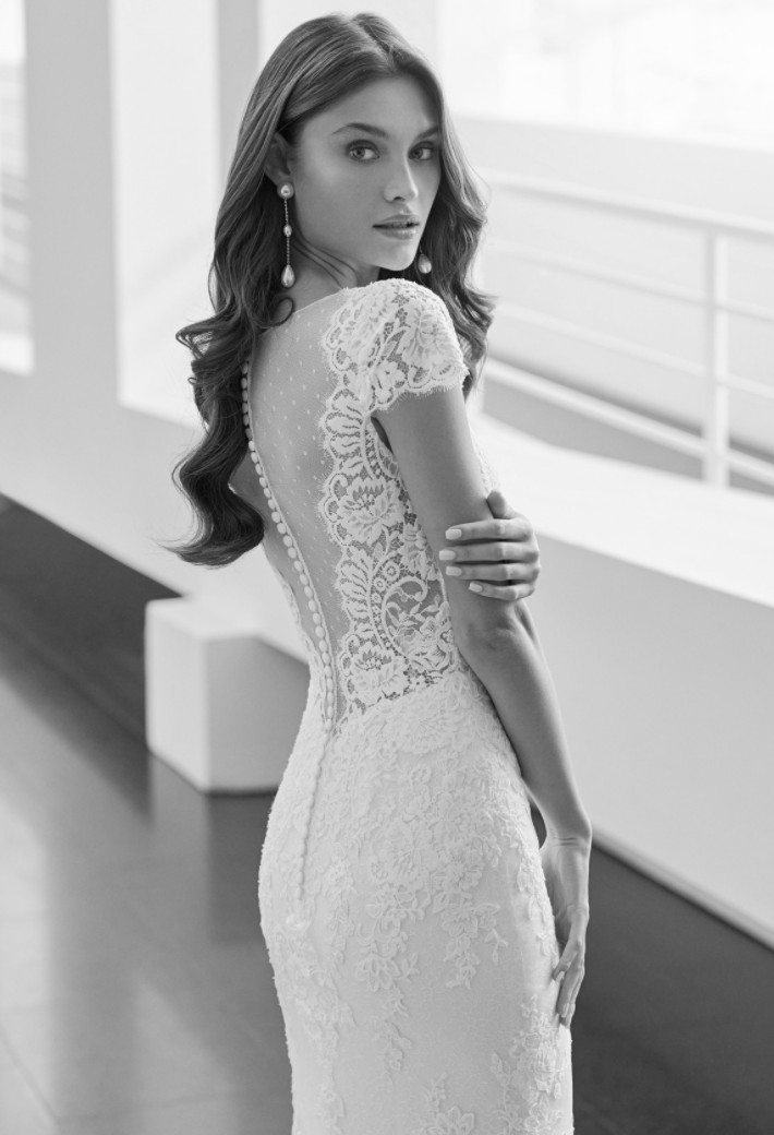 Photo of the model wearing a white bridal gown