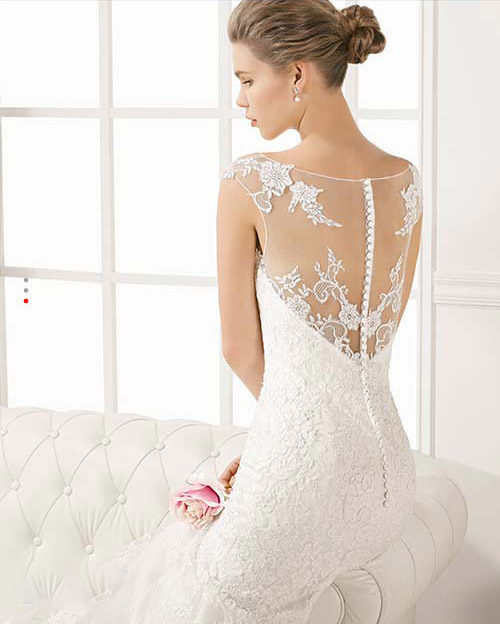 Mermaid bridal gown with lace accents from Rosa Clara