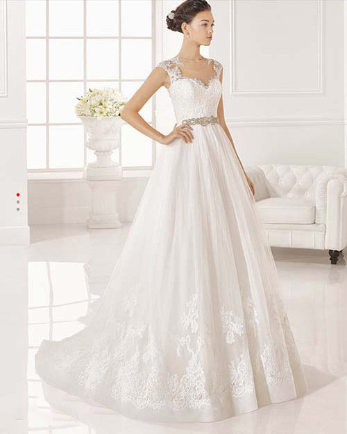Jeweled waistline with lace-capped sleeved bridal gown from Rosa Clara