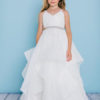 Style 5132 is a full length dress with spaghetti straps and a pleated organza bodice. It features an organza asymmetrical full length skirt with horse hair trim. The waist is accented by a bling ribbon that ties to a bow in the back. Satin buttons cover the zipper.
