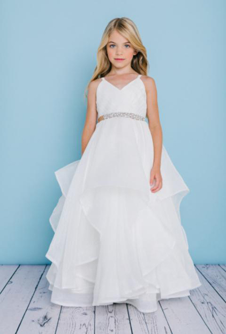 Style 5132 is a full length dress with spaghetti straps and a pleated organza bodice. It features an organza asymmetrical full length skirt with horse hair trim. The waist is accented by a bling ribbon that ties to a bow in the back. Satin buttons cover the zipper.