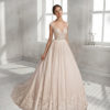 A-line beaded lace and tulle wedding dress with V-neckline and low back.