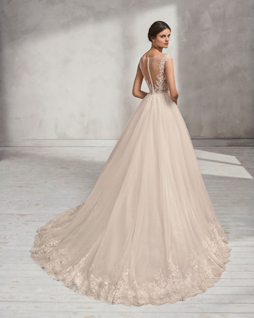 A-line beaded lace and tulle wedding dress with V-neckline and low back.