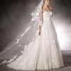 Lace embellishes this marvelous, romantic, princess wedding dress and classic silhouette. A sleeveless design in tulle with thread embroidery appliqués and gemstones all over the dress. A beautiful sweetheart neckline.