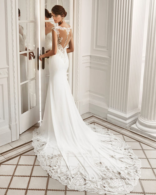 Mermaid-style crepe Georgette and lace wedding dress with deep-plunge neckline and low back.