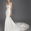 Mermaid-style crepe Georgette and lace wedding dress with deep-plunge neckline and low back.