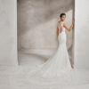 Mermaid-style crepe and lace wedding dress with sweetheart neckline and lace back.