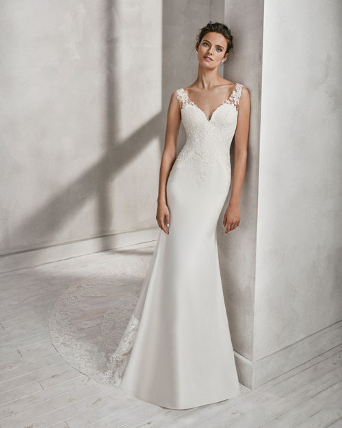 Mermaid-style crepe and lace wedding dress with sweetheart neckline and lace back.