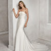 Mermaid-style beaded lace and crepe strapless wedding dress.