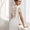 Mermaid-style crepe wedding dress with short sleeves, bateau neckline and guipure lace back.