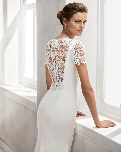 Mermaid-style crepe wedding dress with short sleeves, bateau neckline and guipure lace back.