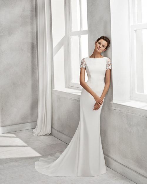 Mermaid-style crepe wedding dress with short sleeves, bateau neckline and guipure lace back.