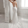 Mermaid-style crepe Georgette wedding dress with halter neckline and beaded back.