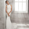 Mermaid-style crepe Georgette wedding dress with halter neckline and beaded back.