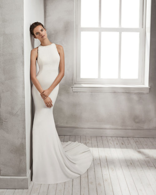 Mermaid-style crepe Georgette wedding dress with halter neckline and beaded back.