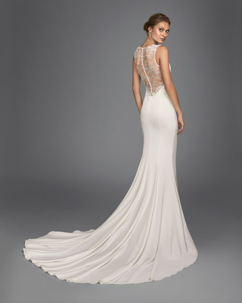 Mermaid-style crepe wedding dress with beaded lace back.