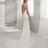 Mermaid-style beaded lace wedding dress with V-neckline and low back.