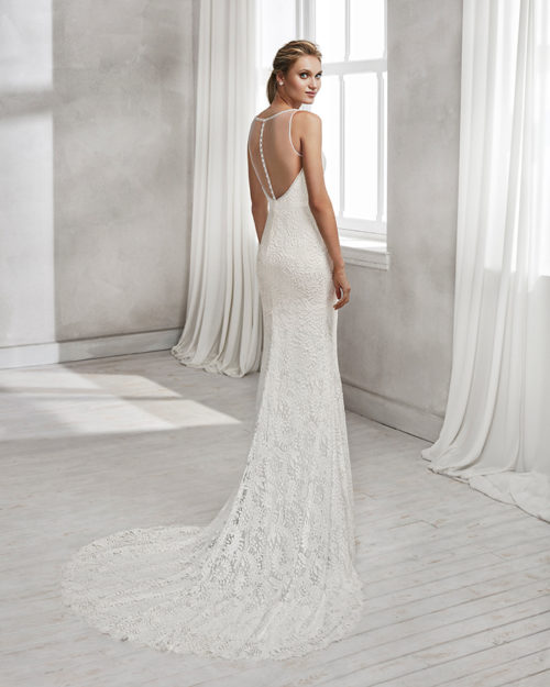 Mermaid-style beaded lace wedding dress with V-neckline and low back.