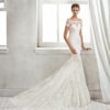 Mermaid-style lace wedding dress with off-the-shoulder neckline and lace appliqués, in nude and natural