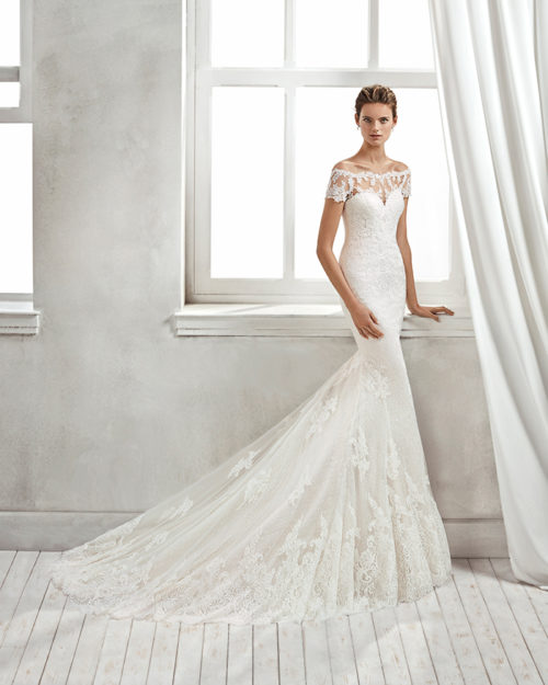 Mermaid-style lace wedding dress with off-the-shoulder neckline and lace appliqués, in nude and natural