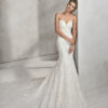 Mermaid-style lace wedding dress with sweetheart neckline.