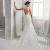 Mermaid-style beaded lace wedding dress with low back, in ivory and natural.