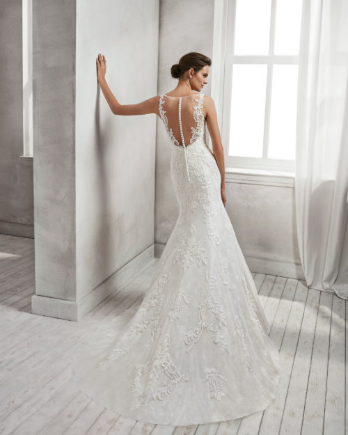 Mermaid-style beaded lace wedding dress with low back, in ivory and natural.
