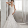 Mermaid-style beaded lace wedding dress with low back, in ivory and natural.