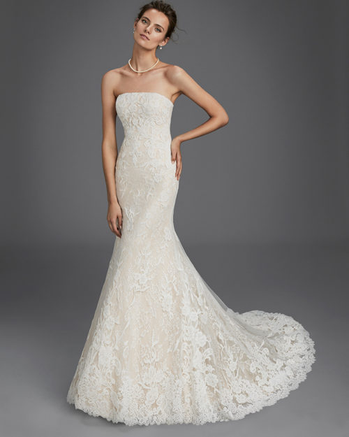 Mermaid-style lace strapless wedding dress, in nude and natural.