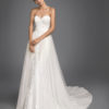 Mermaid-style beaded lace wedding dress with sweetheart neckline and tulle overskirt.