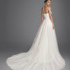 Mermaid-style beaded lace wedding dress with sweetheart neckline and tulle overskirt.