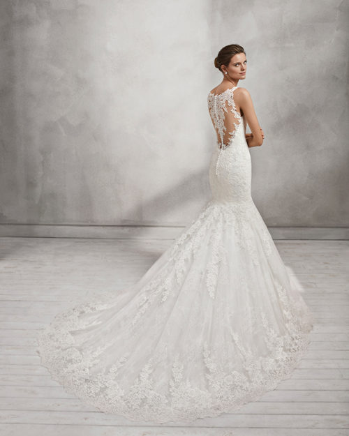 Mermaid-style lace wedding dress with tattoo-effect back.