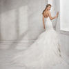 Mermaid-style beaded lace wedding dress with V-neckline and low back.