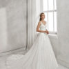 A-line beaded lace and tulle wedding dress with V-neckline and low back.