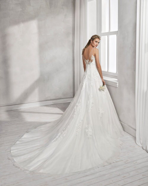 A-line beaded lace and tulle wedding dress with V-neckline and low back.