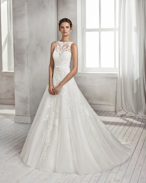 A-line beaded lace and tulle wedding dress with illusion neckline and low back.