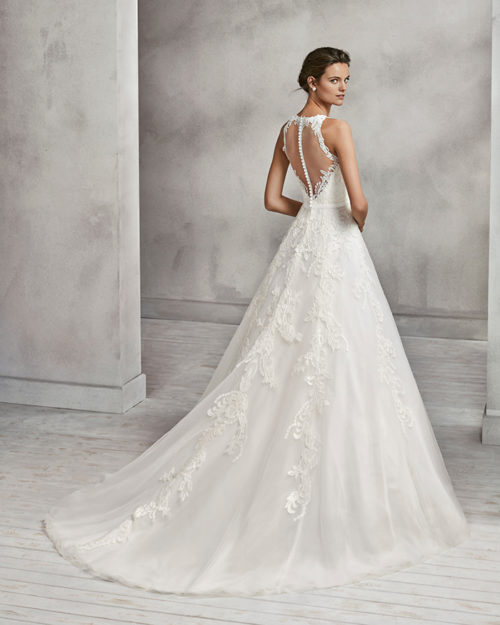 A-line beaded lace and tulle wedding dress with illusion neckline and low back.