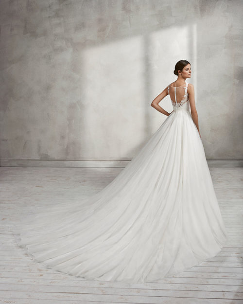 Princess-style beaded lace wedding dress with square neckline, low back and full tulle skirt.