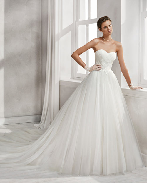 Princess-style beaded lace and tulle wedding dress with sweetheart neckline.