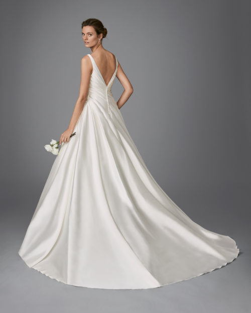 Classic-style mikado wedding dress with V-neckline and gathered side.