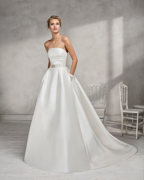 Classic-style mikado strapless wedding dress with beaded belt.