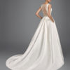 Classic-style beaded brocade wedding dress with bateau neckline, pockets, beaded back and beaded appliqués.