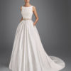 Classic-style beaded brocade wedding dress with bateau neckline, pockets, beaded back and beaded appliqués.