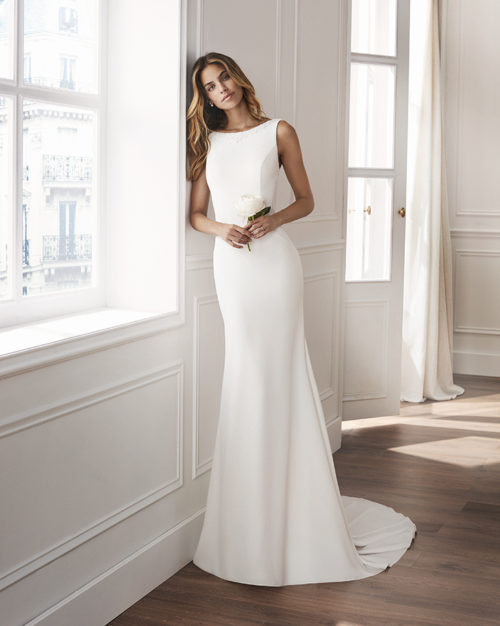 Classic lines with a low-cut back. Wedding gown for the bride who loves tradition.