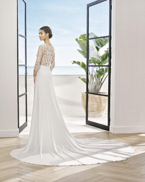 Sheath-style wedding dress in lace and crepe Georgette with beaded neckline. V-neckline and back.