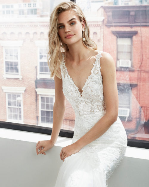 LAURANA Mermaid-style lace and dot tulle wedding dress with beading at the neckline and armholes and deep-plunge neckline.