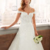 LIANI Princess-style lace and dot tulle wedding dress with sweetheart neckline, V-back with beaded strap and full skirt.