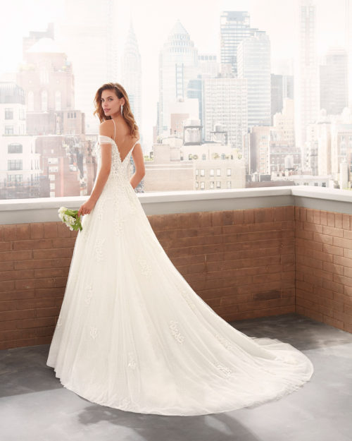 LIANI Princess-style lace and dot tulle wedding dress with sweetheart neckline, V-back with beaded strap and full skirt.