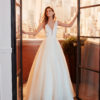 LUCER Classic beaded lace wedding dress with deep-plunge neckline and low V-back.