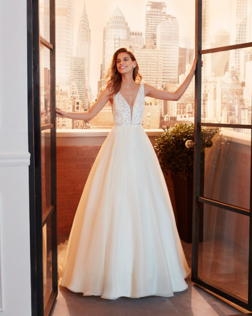 LUCER Classic beaded lace wedding dress with deep-plunge neckline and low V-back.